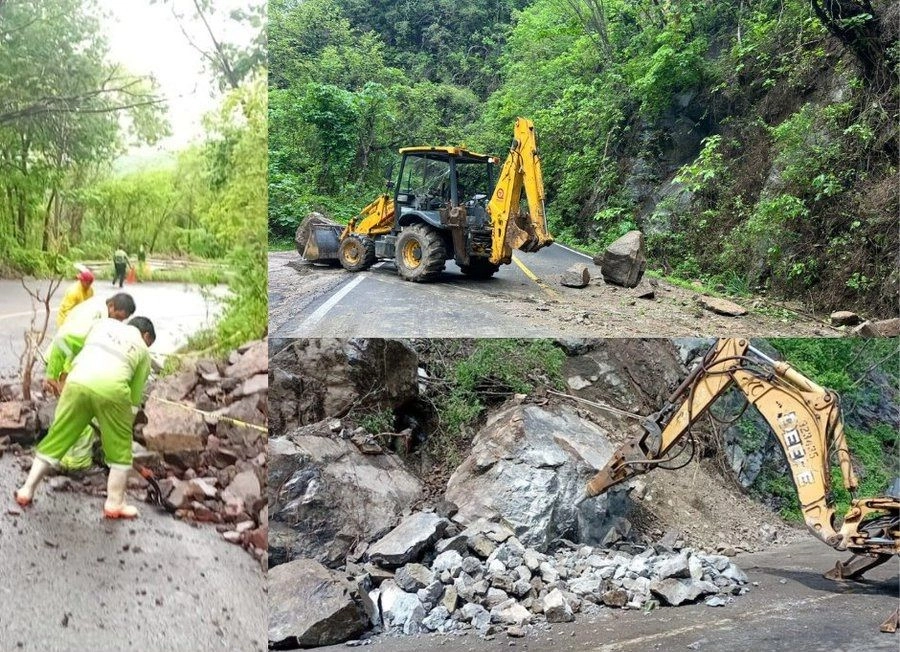 Maquinaria y trabajadores de la SICT retirando los escombros.